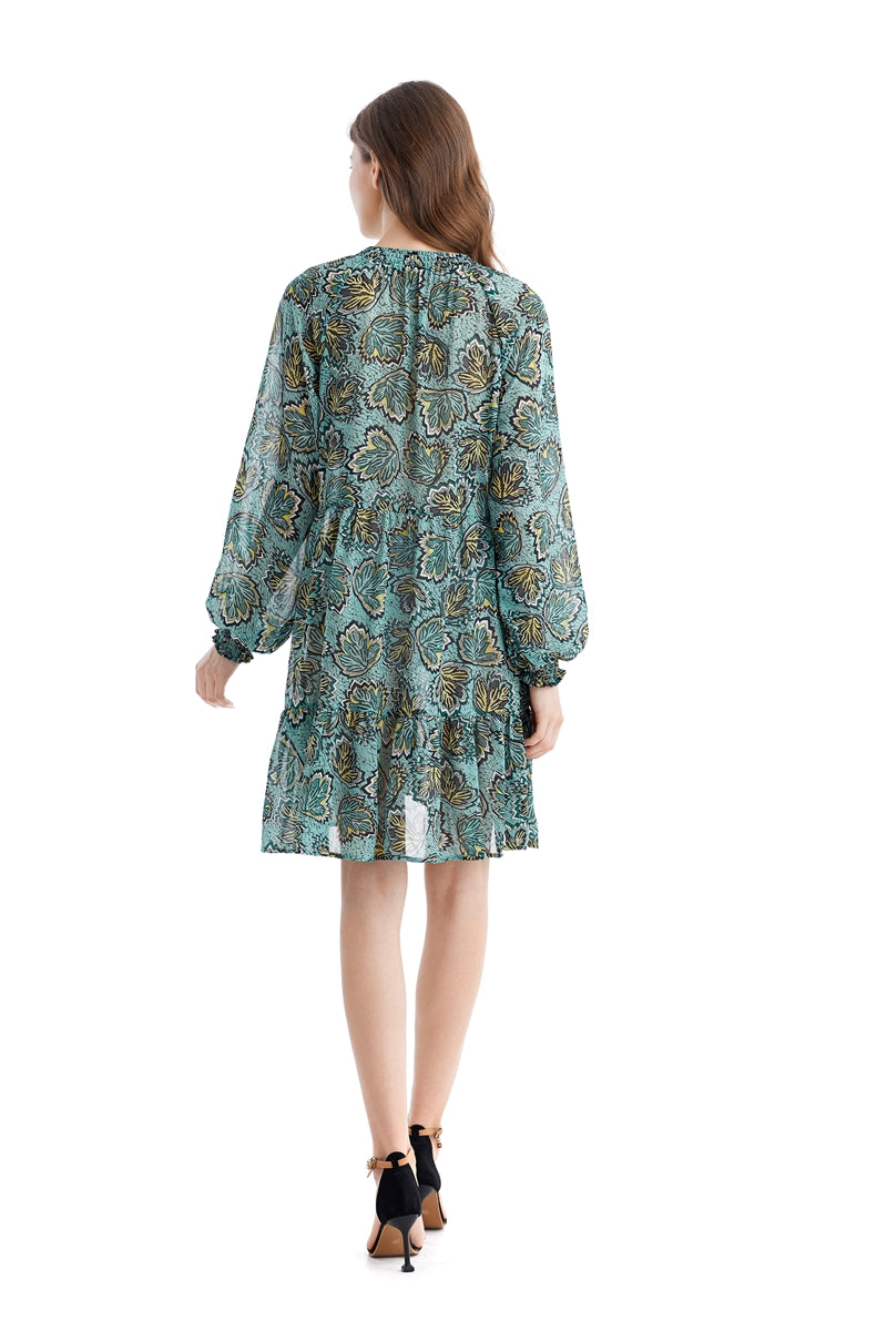 Teal Simba chiffon dress with loose waist fit and printed design, showcasing elegant and flowing fabric.