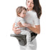 Maroon Chronos collapsible hipseat carrier for kids and babies, shown in a folded and in-use position with adjustable straps.