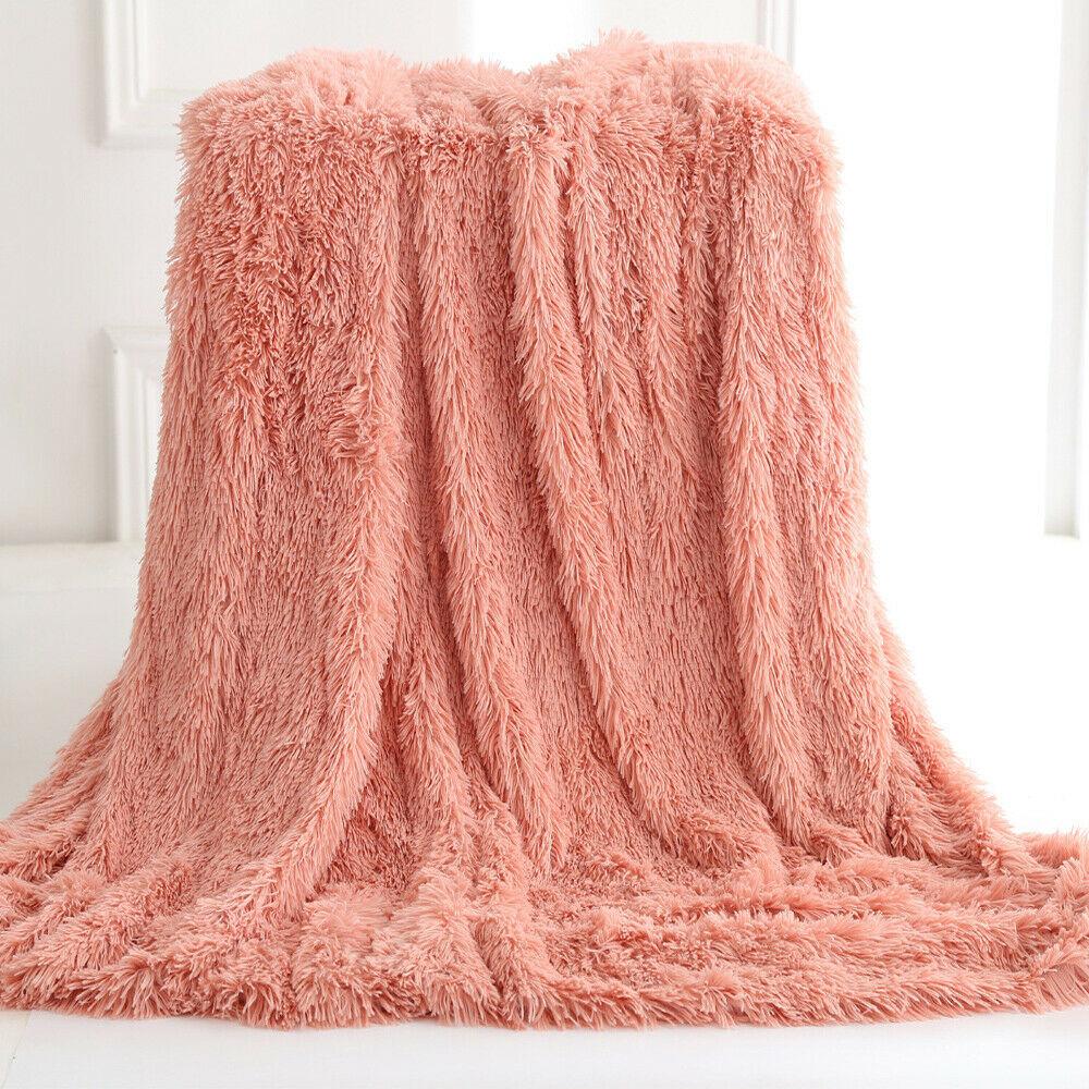 Yellow Pandora Ultra Soft Faux Fur Throw Blanket draped over a cozy armchair in a home setting.