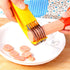 Fuchsia Molly Banana Ham Slicer in a home kitchen, showing its stainless steel blade and ergonomic handle for precise slicing.