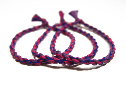 Handmade cotton bisexual friendship bracelet with LGBTQ pride colors from Rose Erebus, featuring vibrant rainbow and pink accents.