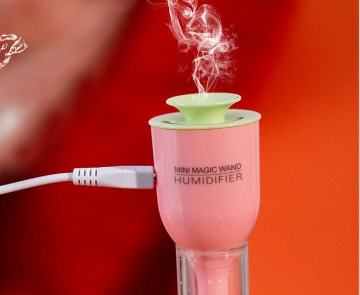 Fuchsia Molly mini USB magic wand humidifier for automotive use, compact device with a sleek design for moisture in cars.
