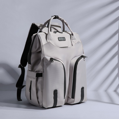 Carmine Juneberry AllFashion SmartMom Travel+ diaper backpack with multiple compartments and adjustable straps for moms on the go.