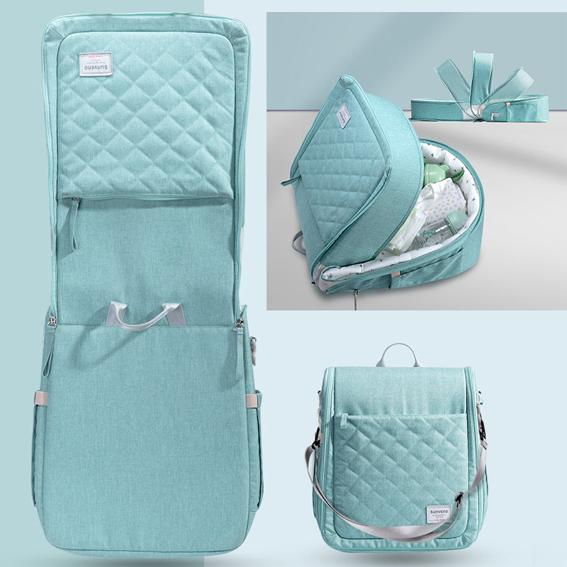 Maroon Chronos portable baby diaper bag backpack with changing pad, designed for travel and convenient parent on-the-go use.