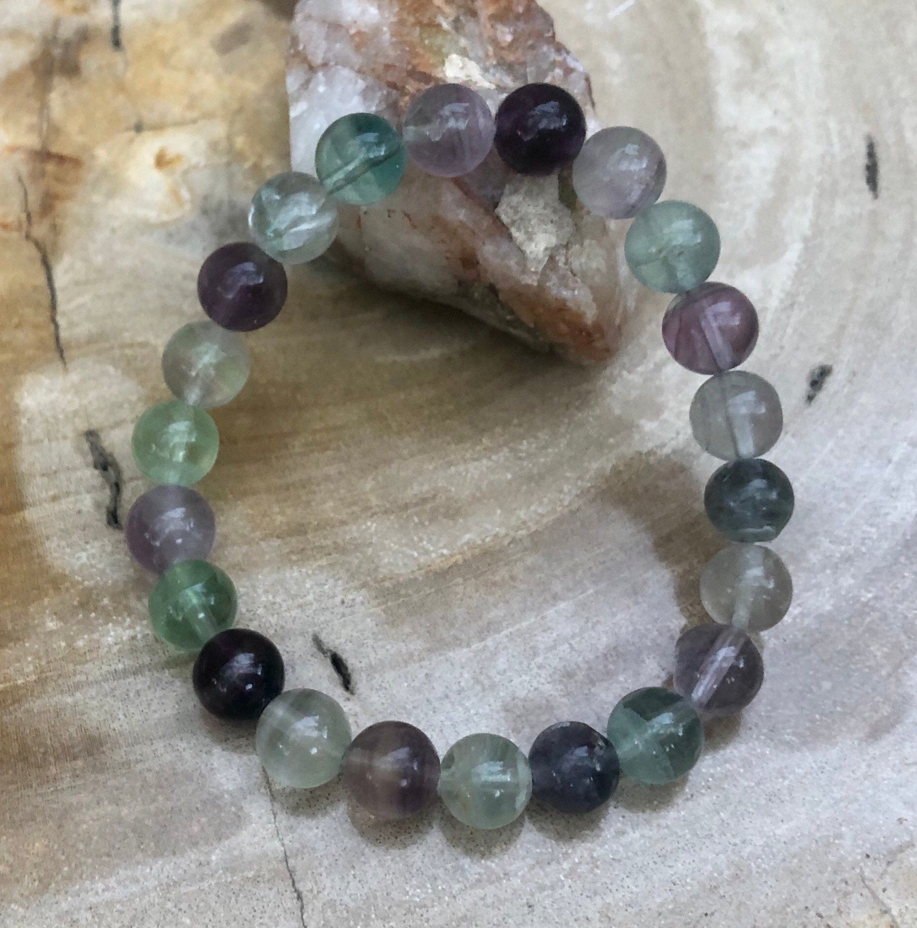 Rainbow Fluorite stretch bracelet by Violet Chaos featuring colorful, natural fluorite stones on an elastic band.