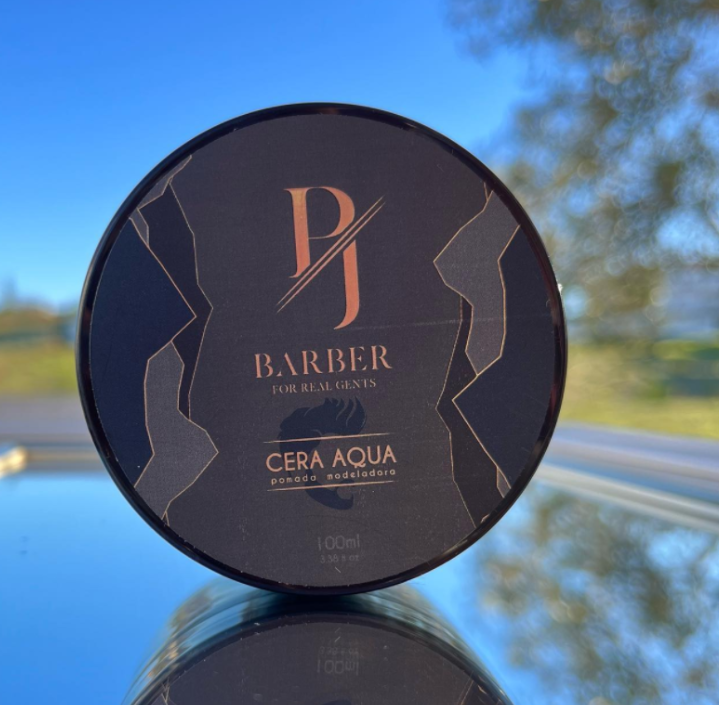 Lilac Eros Aqua Wax hair styling product in a jar, showcasing the blue-tinted hair wax for flexible hold and shine.