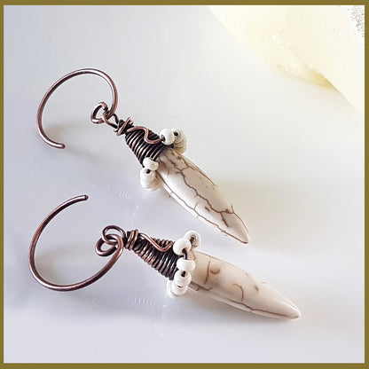 Copper wire wrapped Howlite spike earrings by Maroon Smudge featuring white and gray stone spikes with intricate wire detailing.