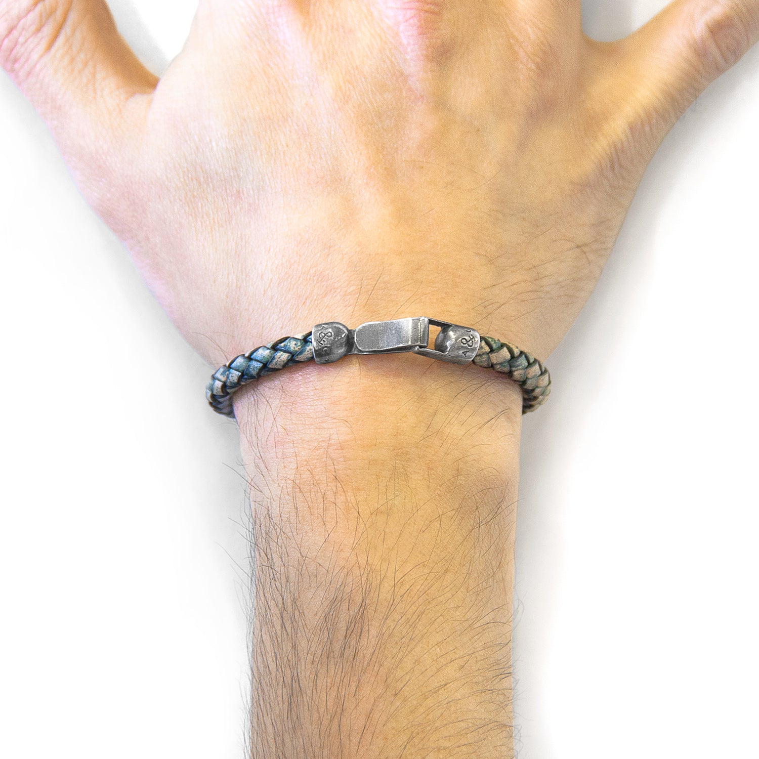 Petrol green Skye silver and braided leather bracelet by Magenta Sooty showing silver accents and braided leather band.