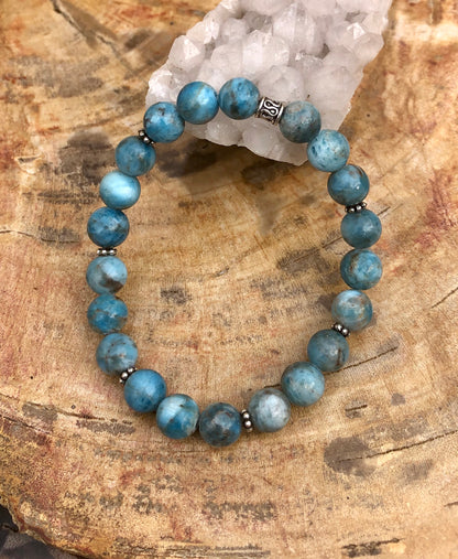 Blue Apatite gemstone stretch bracelet with natural stones, featuring a vibrant blue color and elastic band for a comfortable fit.