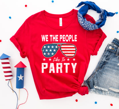 Agate "We the People Like to Party" T-shirt with bold printed slogan, casual fit, and comfortable cotton fabric.