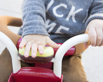 Taupe Pear Evolutive Tricycle for biking, featuring a sturdy frame, comfortable seat, and adjustable handlebars for young riders.