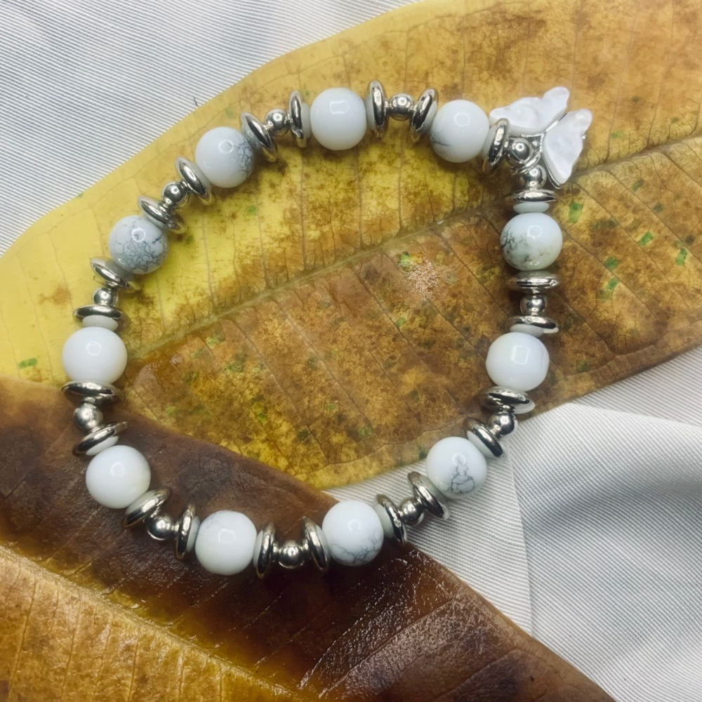 Jasper bead bracelet for women with silver spacer beads, stretch design, by Tan Saffron, featuring natural stone and metallic accents.