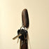 Walnut magnet key holder from Fuchsia Molly, mounted on wall with hooks for organizing keys in a home and garden setting.