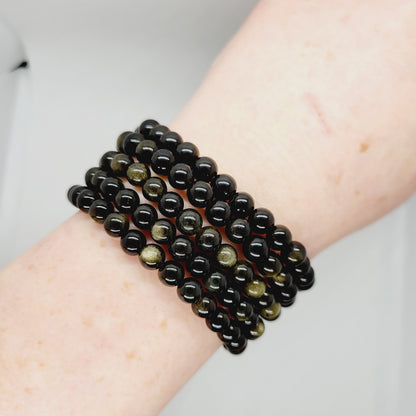 Gold sheen obsidian stone bracelet from Olive Coeus featuring polished beads in a boho style, ideal for metaphysical and Reiki practices.