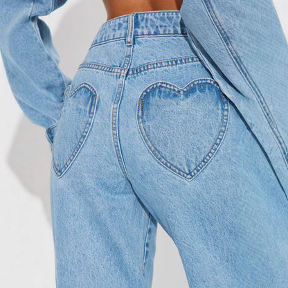 Carmine Juneberry straight fit denim jeans in 25 edition, shown in a natural pose highlighting classic blue color and stitching details.