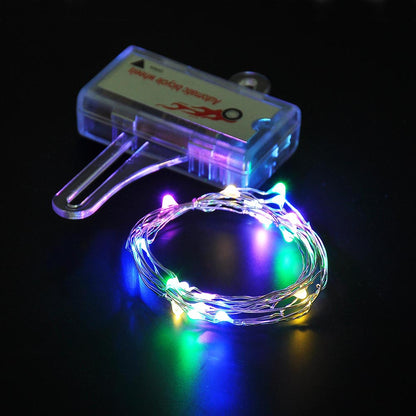 Colorful mini LED bike wheel spoke light by Lilac Milo illuminating bicycle wheels with vibrant, eye-catching light during biking.