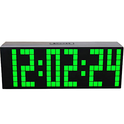Fuchsia Molly home LED digital clock displaying time on a sleek black surface in a home setting