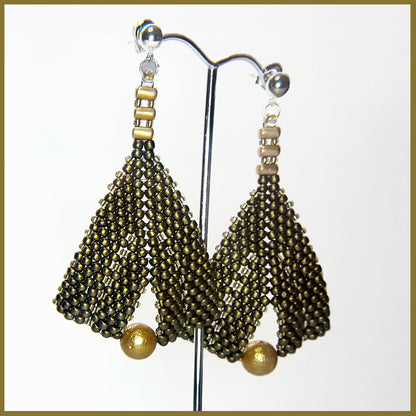 Gold metallic suede and pearl earrings by Maroon Smudge featuring elegant gold and pearl accents with a sleek design.