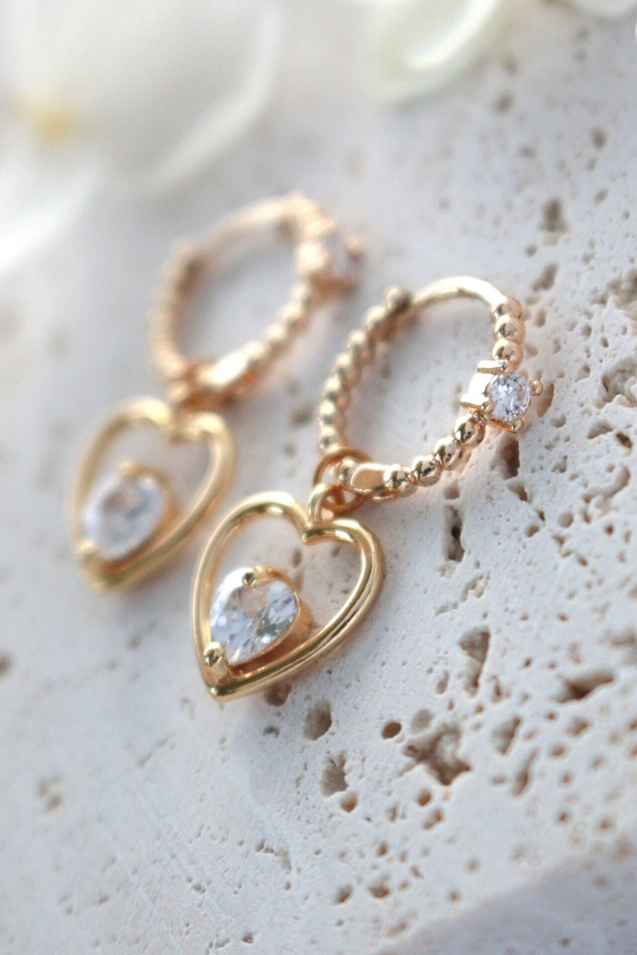 Ultramarine Birch 24 Karats Heart Hoop Earrings, gold-toned earrings with a heart-shaped design and hoop style, close-up view