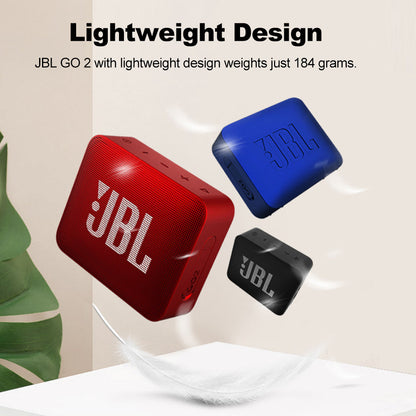 White Eucalyptus waterproof wireless Bluetooth speaker designed for pets, IPX7 rated, portable JBL GO2 style speaker in image.