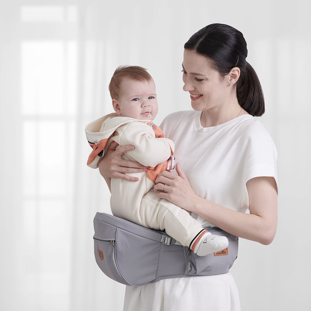 Maroon Chronos ergonomic hip seat with cushion for parenthood, featuring a comfortable padded seat and adjustable straps.