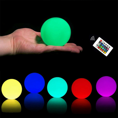 RGB color-changing LED pool lights floating in water, illuminated Lilac Milo floating ball lights for outdoor pool lighting.