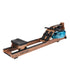 Olive Nyx Topiom rowing machine for home use with solid wood frame and TM3 monitor, showing the sleek design and adjustable rowing handle.