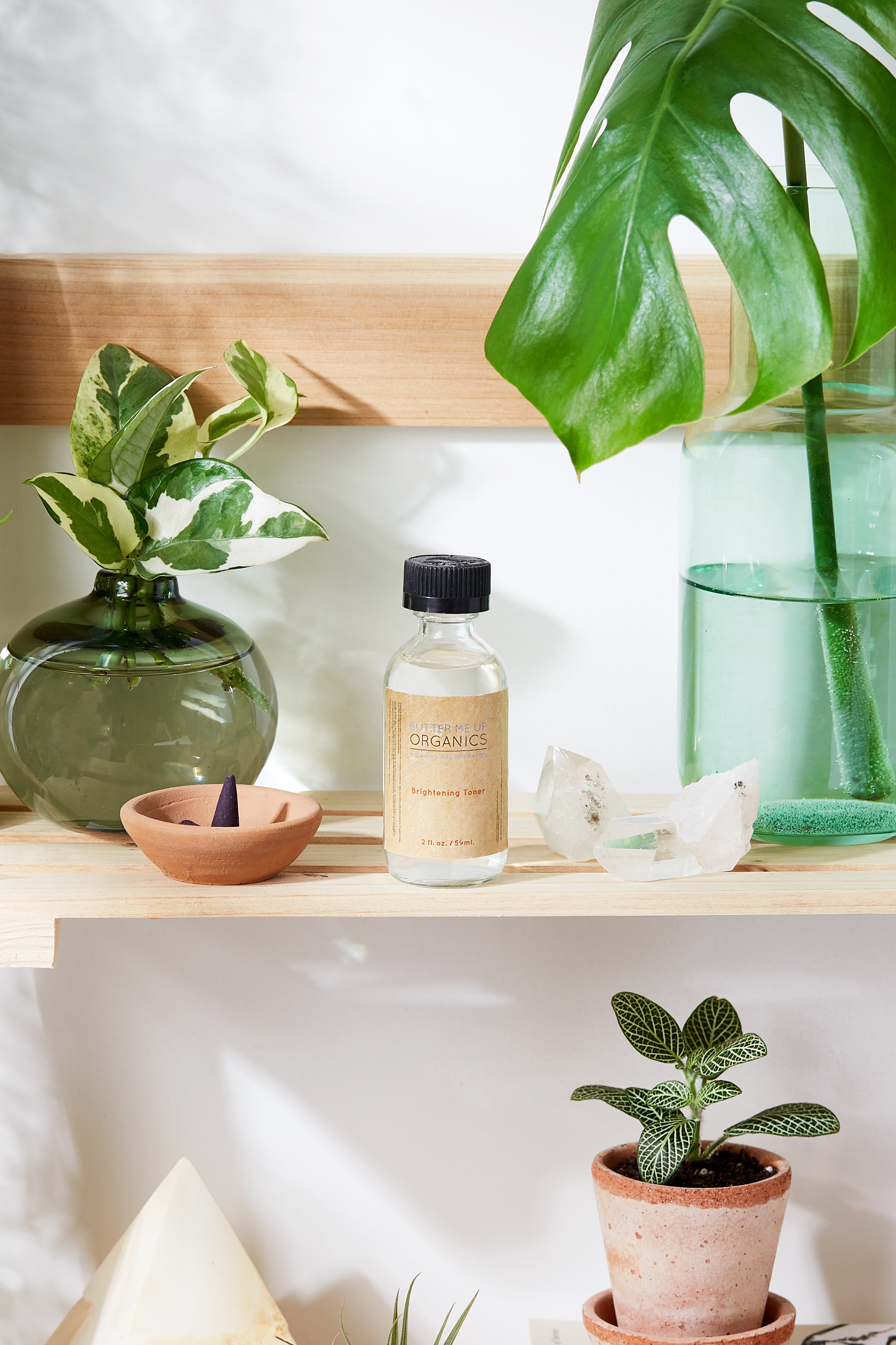 White Smokey Organic Brightening Toner in a clear glass bottle with a white pump dispenser, placed on a neutral background.