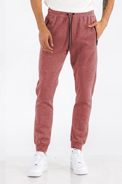 Light gray Heathered Cotton Sweats for men by Lime Milo, showing the relaxed fit and soft fabric with a drawstring waistband.