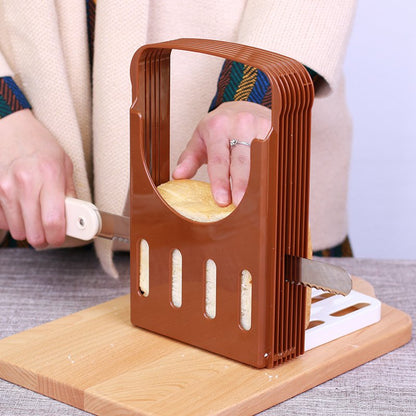 Fuchsia Molly bread slicer for home use, with adjustable blades and sturdy plastic frame, perfect for slicing bread evenly.