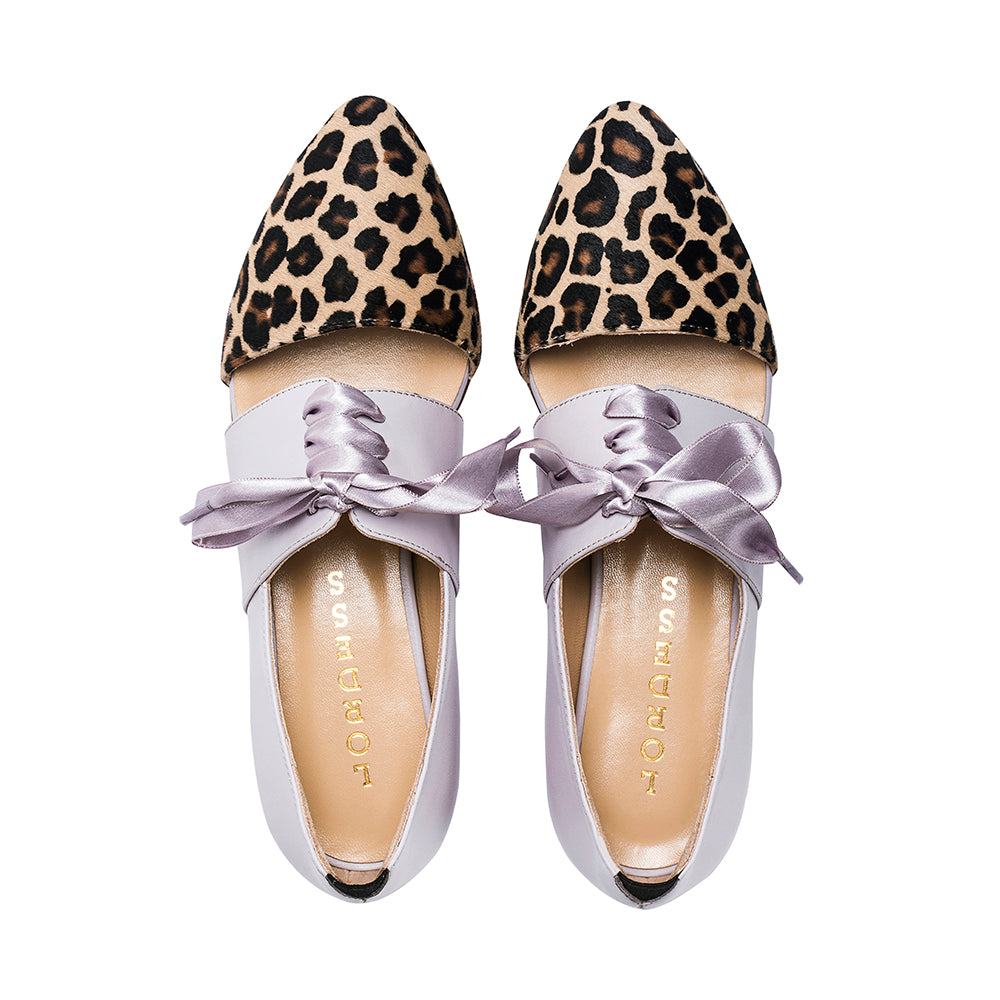 Pink Tulip calf hair leather flats by Indigenous featuring sleek, stylish design with natural animal print and comfortable flat sole.