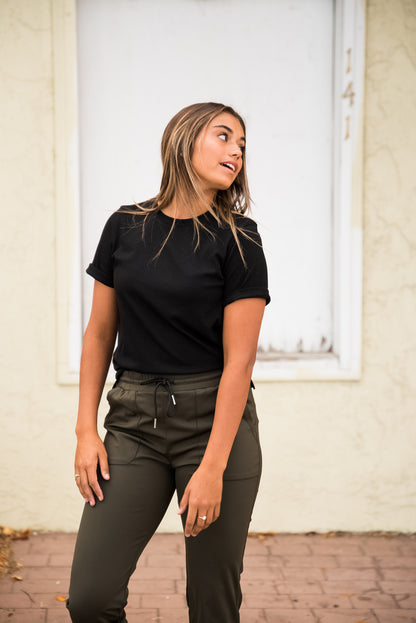 Black DT Alyssa Rib Knit Split Hem Tee by Lavender Danae, showcasing fitted ribbed fabric and stylish split hem detail.