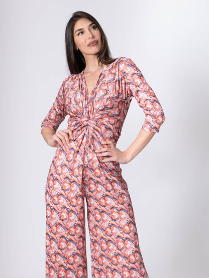 Fuchsia Amymone printed jumpsuit with V-neck, knot detail below the bust, stylish and comfortable for casual wear.