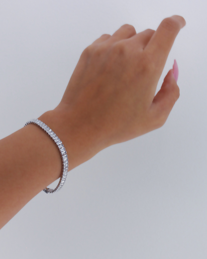 Sterling silver and 18K gold plated Icy Tennis Bracelet by Ultramarine Birch featuring sparkling gemstone accents.