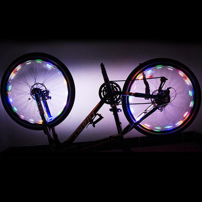 Colorful mini LED bike wheel spoke light by Lilac Milo, illuminating bicycle wheels with vibrant, colorful glow during biking.