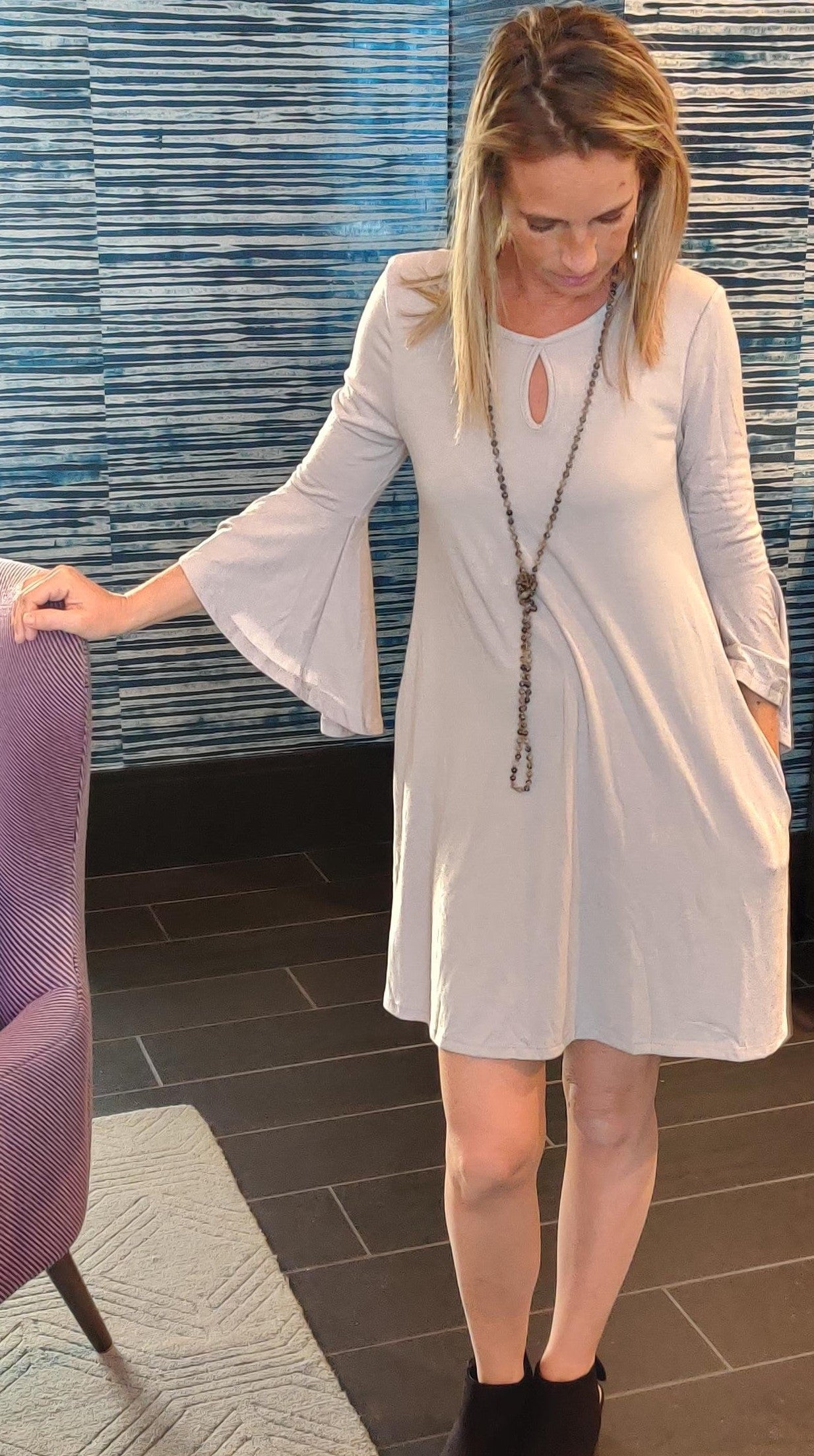 Light gray ruffle sleeve dress with keyhole neckline and pockets by Ochre Ismene, women&