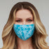 Turquoise paisley floral face mask for women from Cyan Poppy, featuring vibrant paisley and floral patterns on fabric.