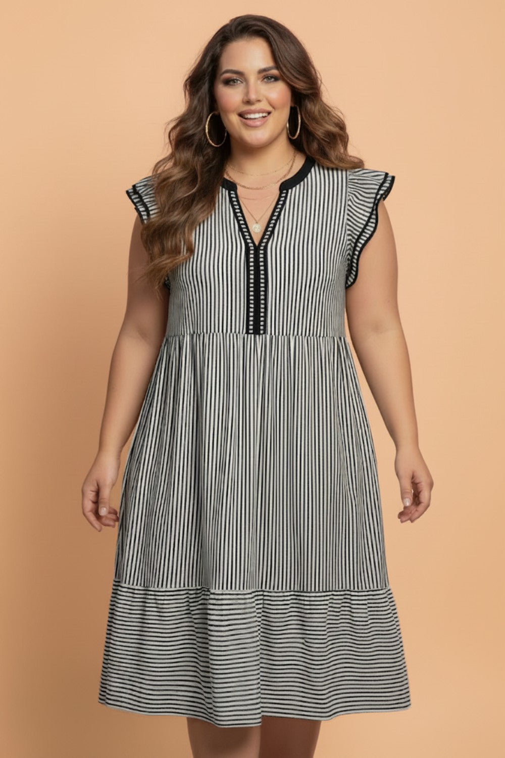 Plus size stripe flutter sleeve V-neck maxi dress by Byzantium Bay, featuring a flowing silhouette and bold horizontal stripes.