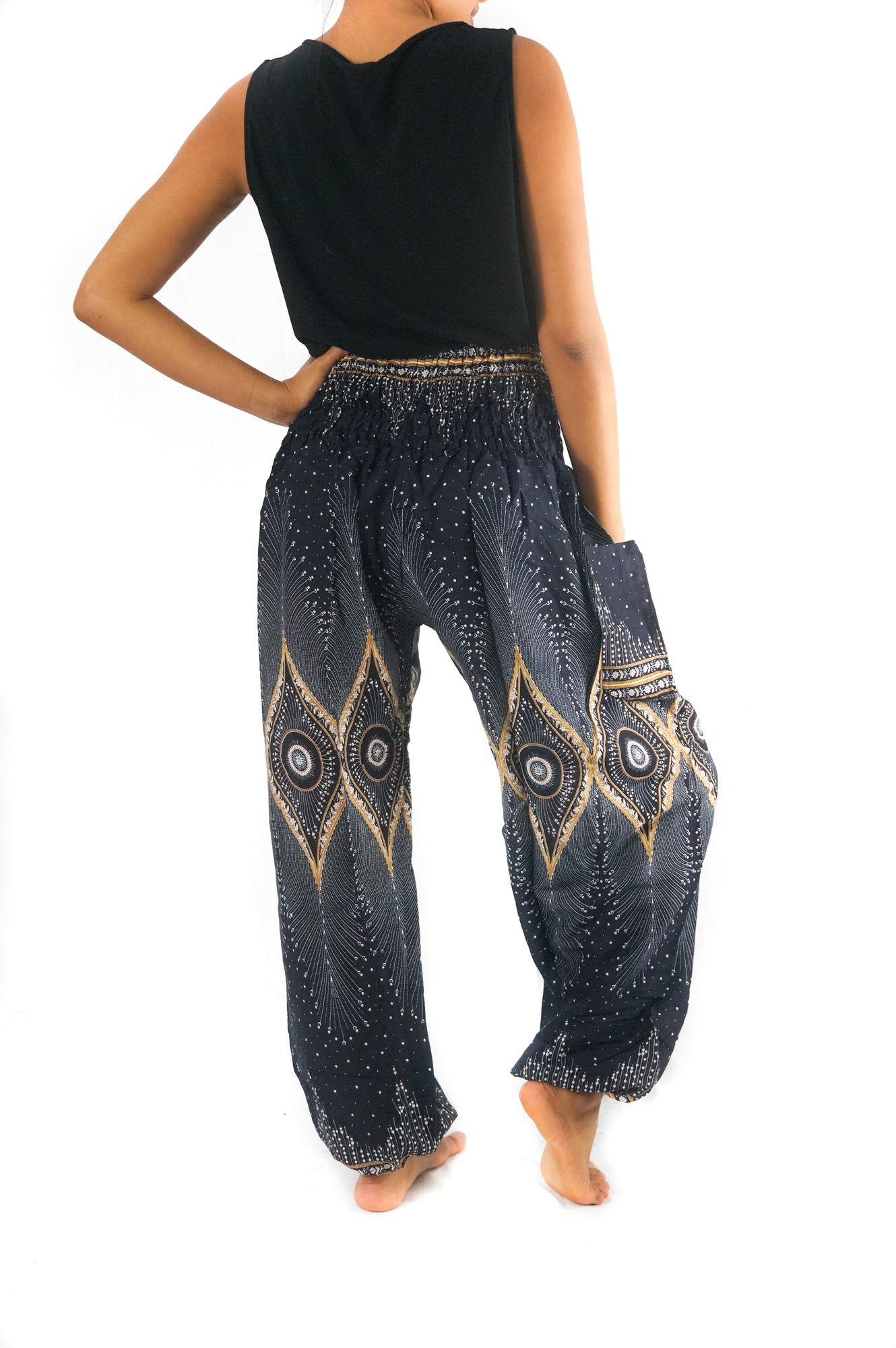 Black PEACOCK women’s boho yoga pants by Tan Smokey featuring a relaxed fit and bohemian style, perfect for casual and yoga wear.