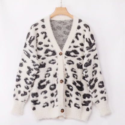 Carmine Juneberry leopard print long sleeve small cardigan sweater, cozy knit with button closure and ribbed cuffs.