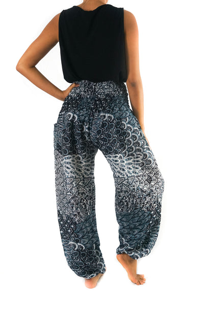 Black peacock boho pants for women by Tan Smokey, featuring flowy hippie style with intricate peacock feather designs.