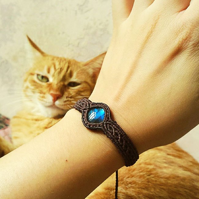 Fuchsia Molly braided moonlight labradorite bracelet featuring iridescent stones and intricate woven design.
