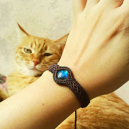 Fuchsia Molly braided moonlight labradorite bracelet featuring iridescent stones and intricate woven design.
