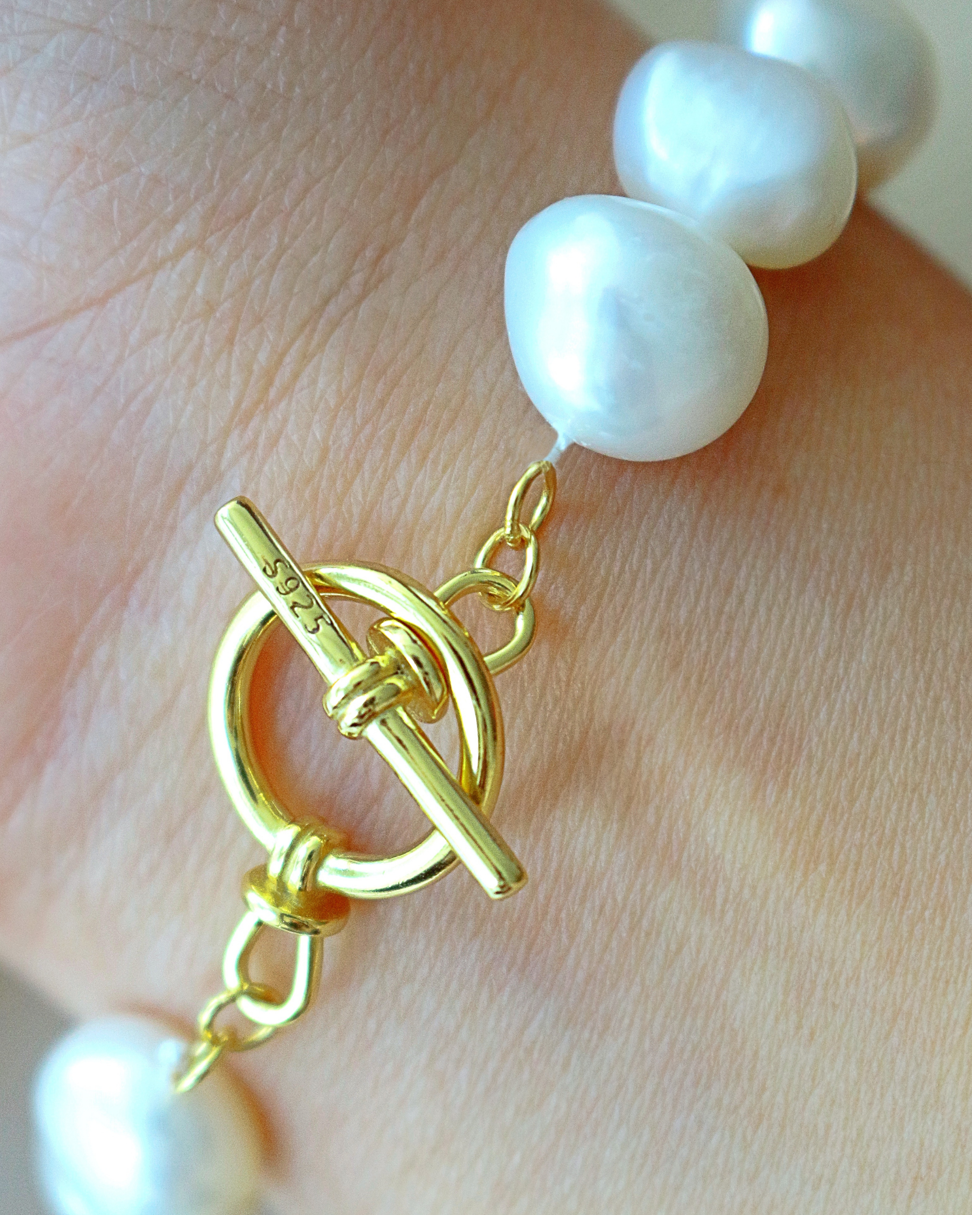 Elegant Ultramarine Birch bracelet with Baroque genuine freshwater pearls and sterling silver accents, showcasing intricate bead details.