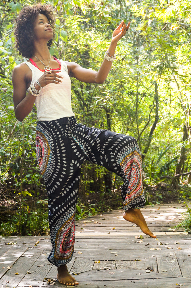 Black Lotus women’s boho harem pants by Tan Smokey, featuring a relaxed fit and hippie style with intricate patterns and flowy fabric.