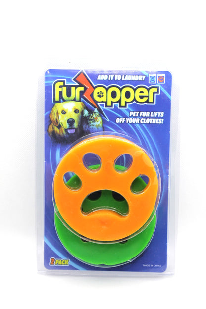 Sky Pandion Fur Zapper pet hair remover device for clothing, showing the handheld tool in use on fabric to remove pet hair.