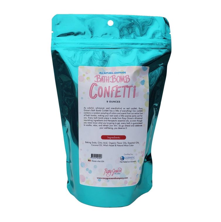 Colorful Orchid Missy Bath Bomb Confetti in a bath setting, showcasing vibrant, mixed-shaped bath &amp; beauty product pieces.