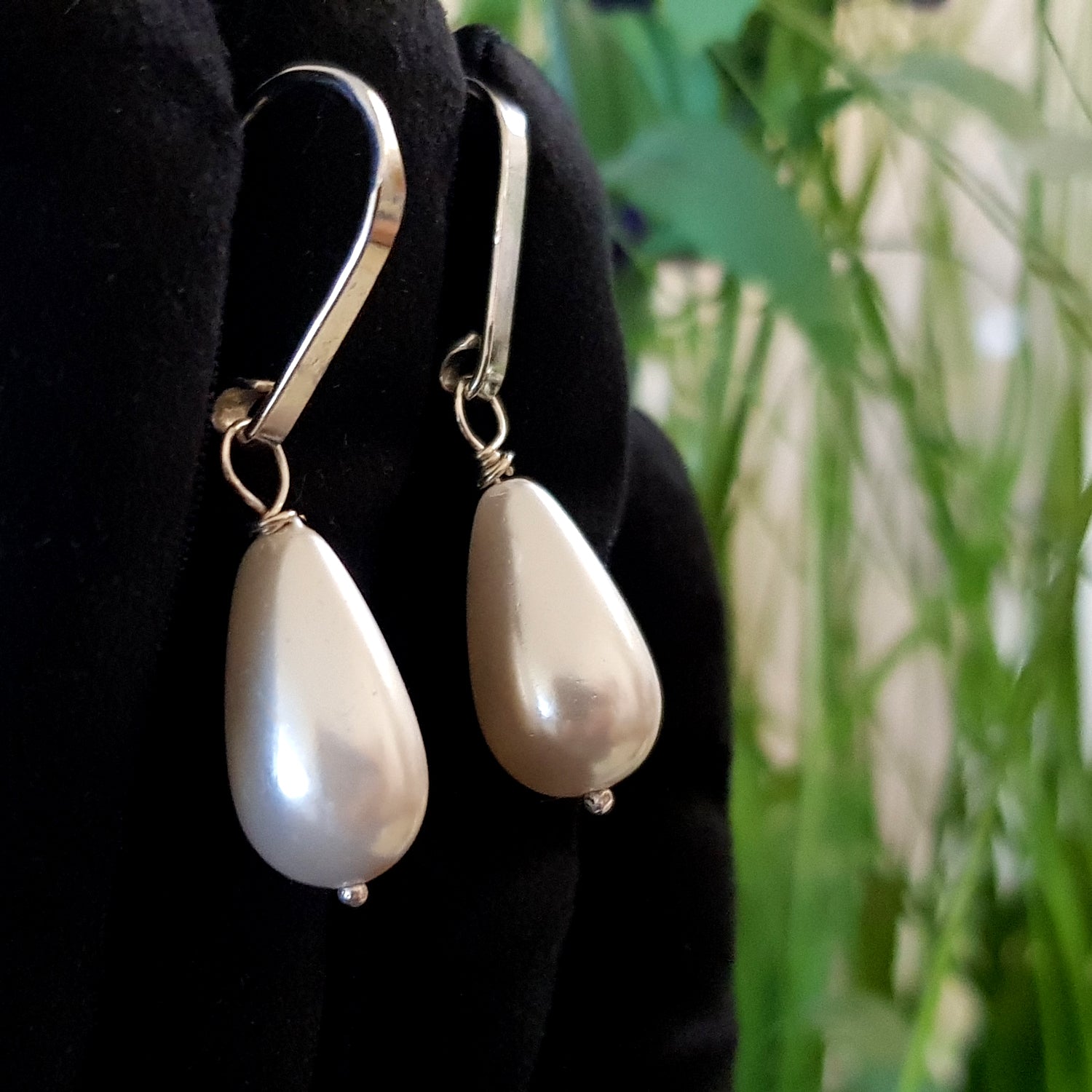 Dew Drop teardrop shell pearl earrings by Maroon Smudge, featuring elegant shell pearls on delicate earrings.