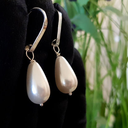 Dew Drop teardrop shell pearl earrings by Maroon Smudge, featuring elegant shell pearls on delicate earrings.