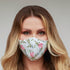 Light green floral face mask for women by Cyan Poppy, featuring a soft fabric with a vibrant floral pattern.